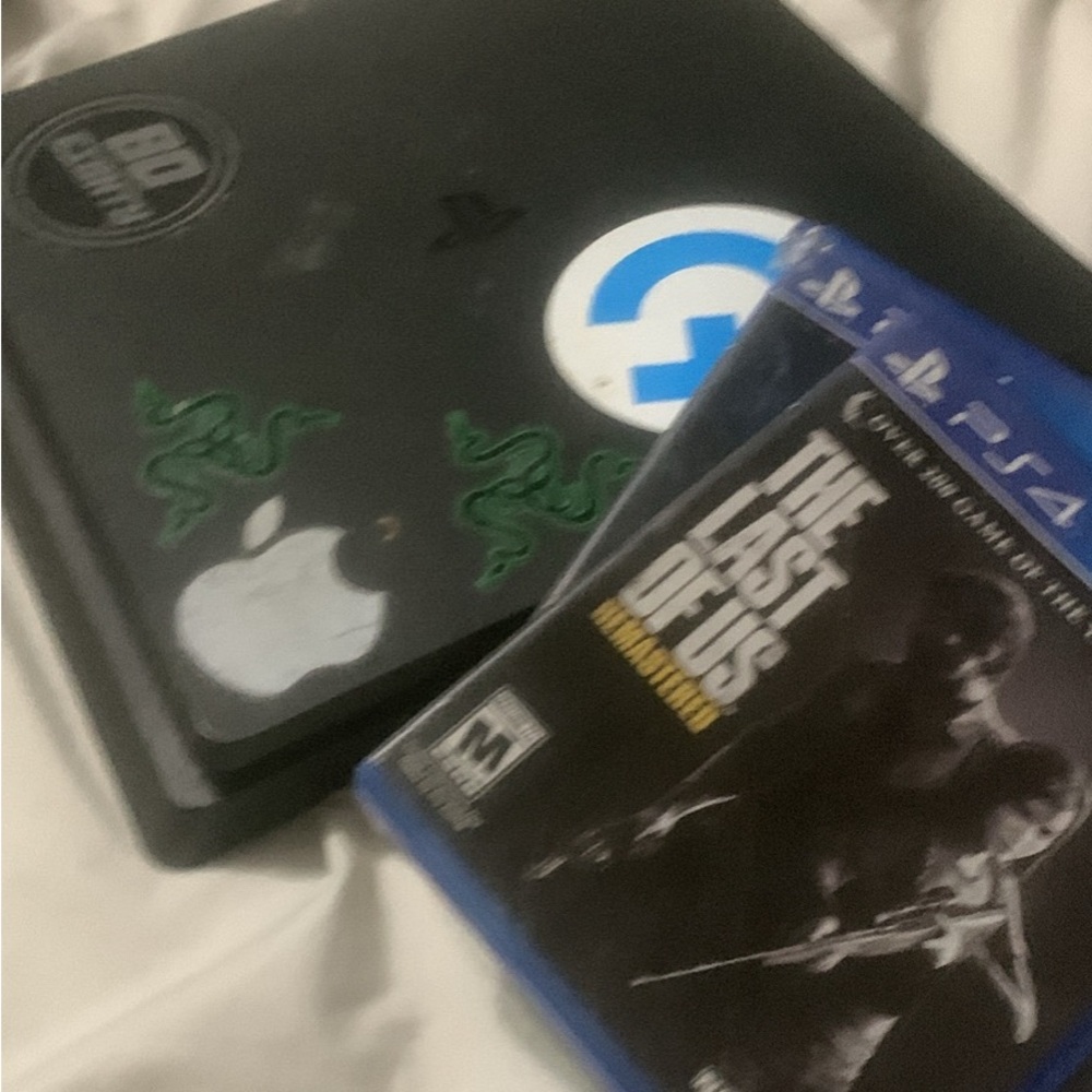Apple MacBook with The Last of Us PS4 Game